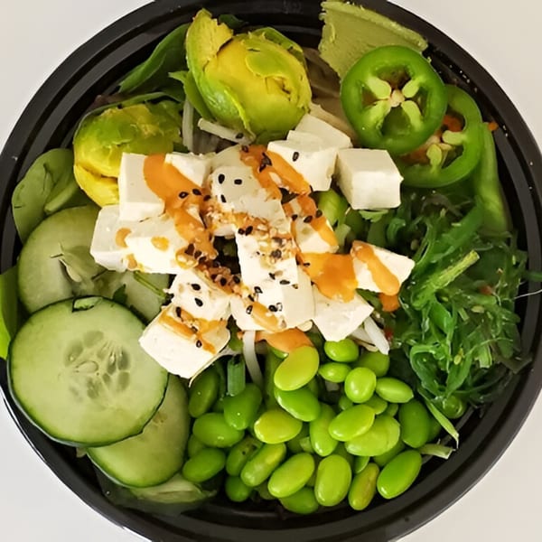 A Grindz poke bowl with tofu, avocado, edamame, cucumber, seaweed, and jalapeños.